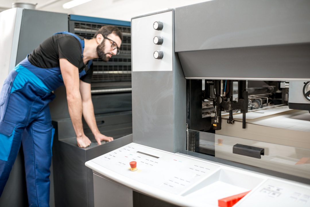 Man working at the printing manufacturing